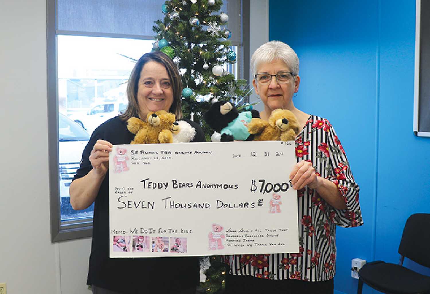 Donna Stanhope and Linda Machniak with the $7,000 raised from the Southeast Rural Teddy Bears Anonymous online auction.